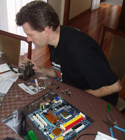 David leaning over the table assembling the motherboard