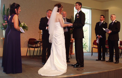 Fiona and David standing during their wedding ceremony