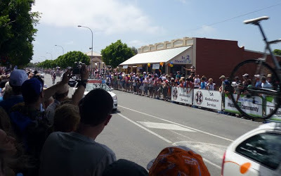 Riders and support cars approaching finish line