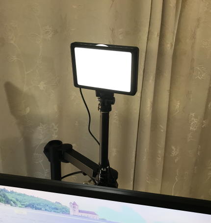 Light on stand behind monitor