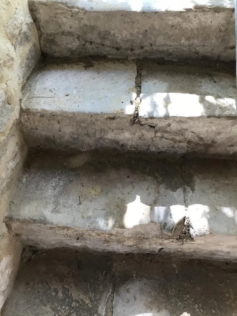 Stone stairway, with sunlight casting shadows