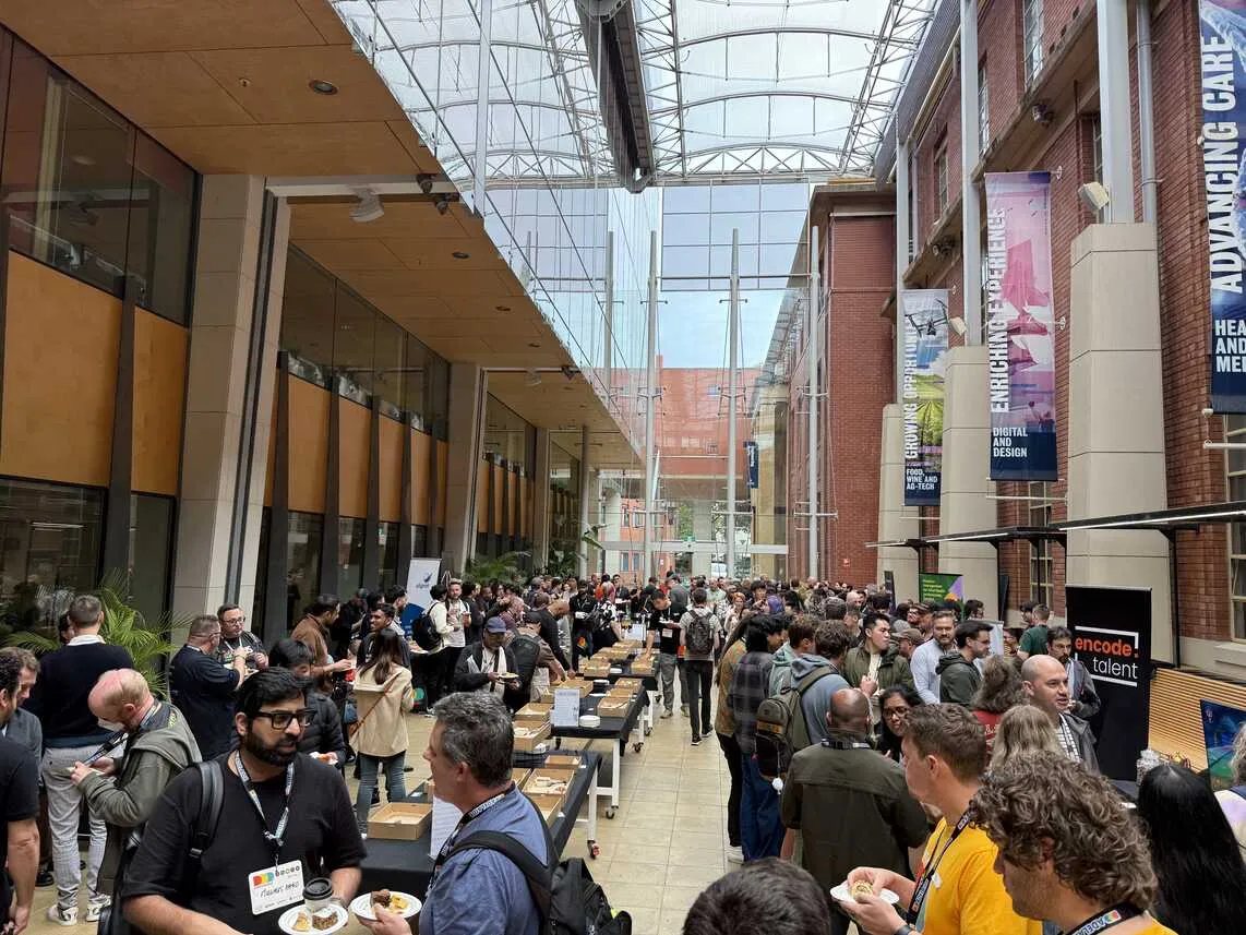 Attendees enjoying afternoon tea and chatting