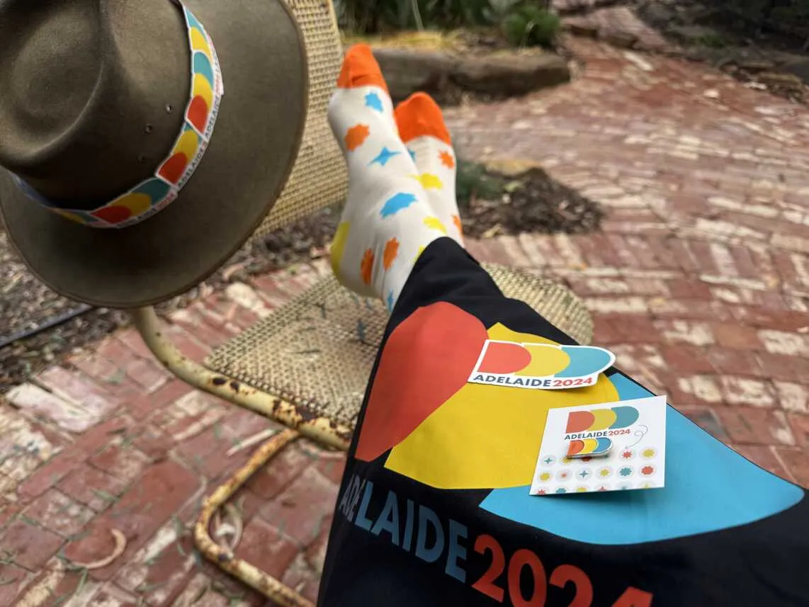 an Akubra hat with DDD sticker hatband, DDD socks, DDD tote bag, stickers and pin