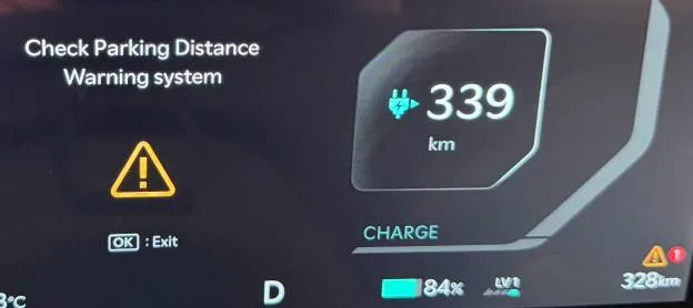 Photo of EV5 dashboard showing ‘Check Parking Distance Warning System’ error