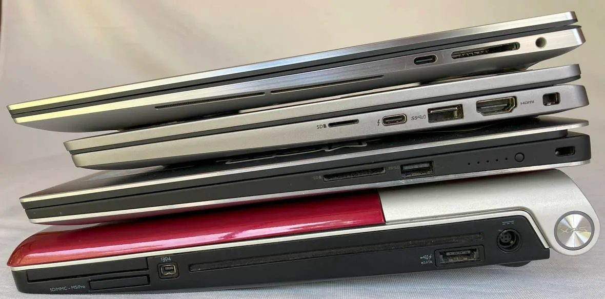 Stack of laptops showing ports on right side