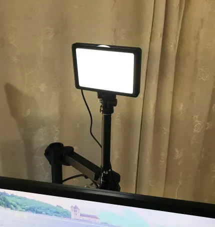Light on stand behind monitor