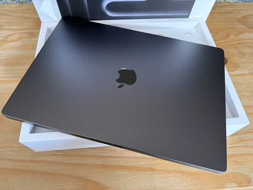 New MacBook Pro laptop sitting on the box it came in
