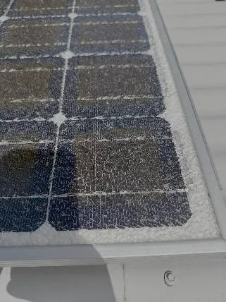 A solar panel with the glass cover all shattered