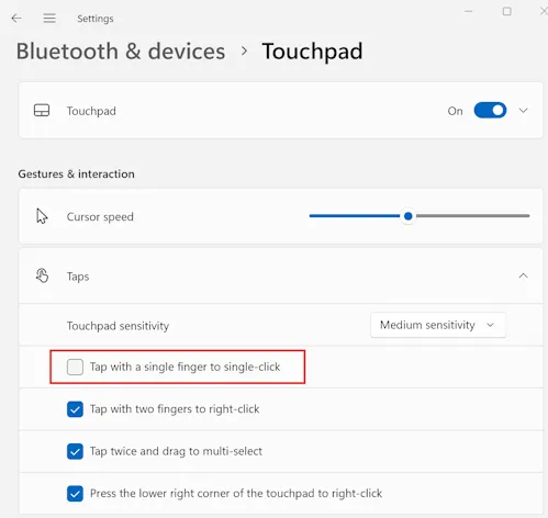 Screenshot of Windows Settings, showing Touchpad configuration, with 'Tap for a single finger to single-click' unchecked