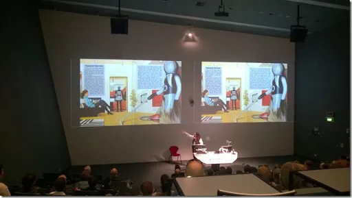 Paul Fenwick with slide of 1970&#x27;s sci fi robots