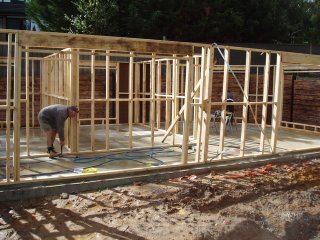 Builders working on framing