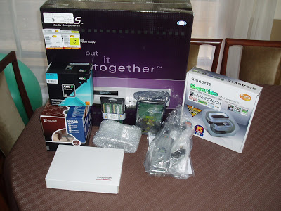 Computer components in boxes and packages on a table