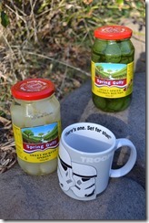 Two jars of pickles and a Storm Trooper mug