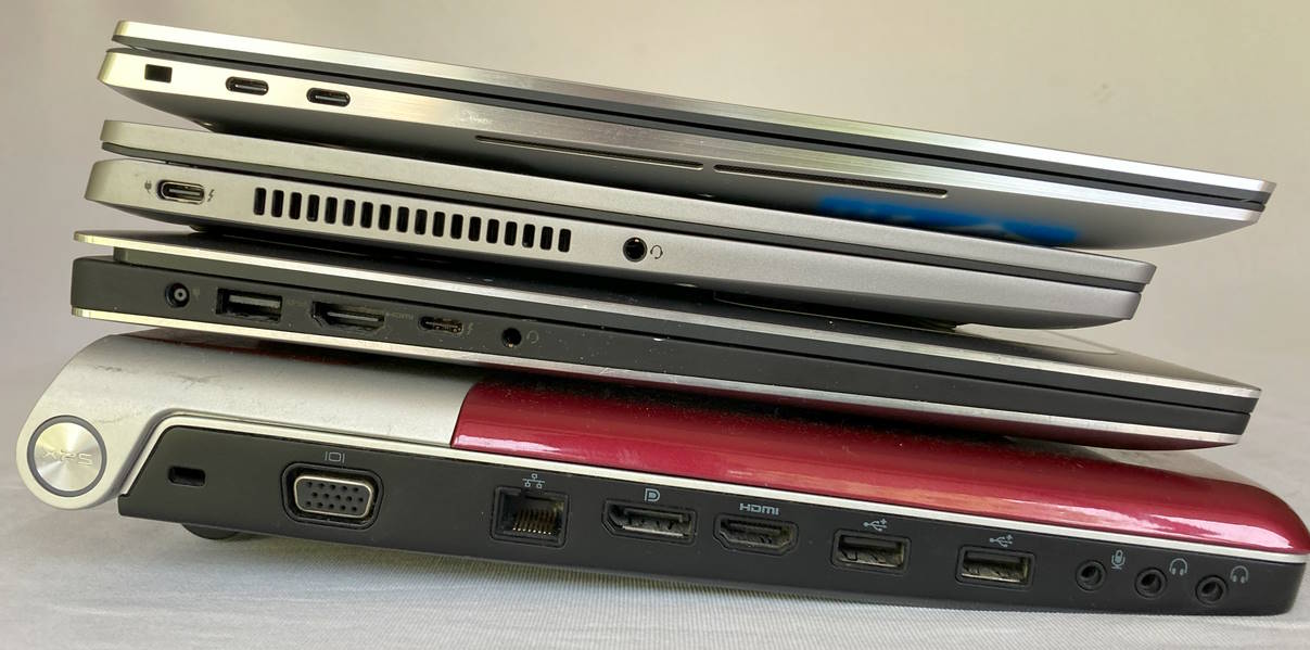 Stack of laptops showing ports on left side