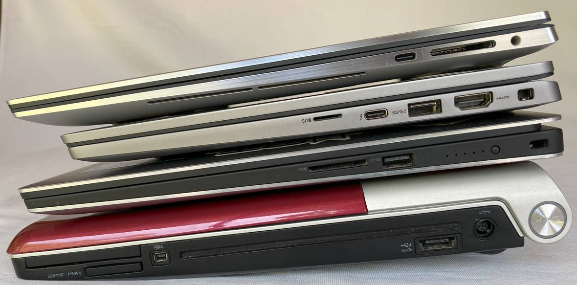 Stack of laptops showing ports on right side
