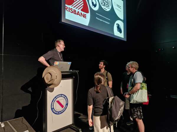 David speaking to some people after his talk had finished