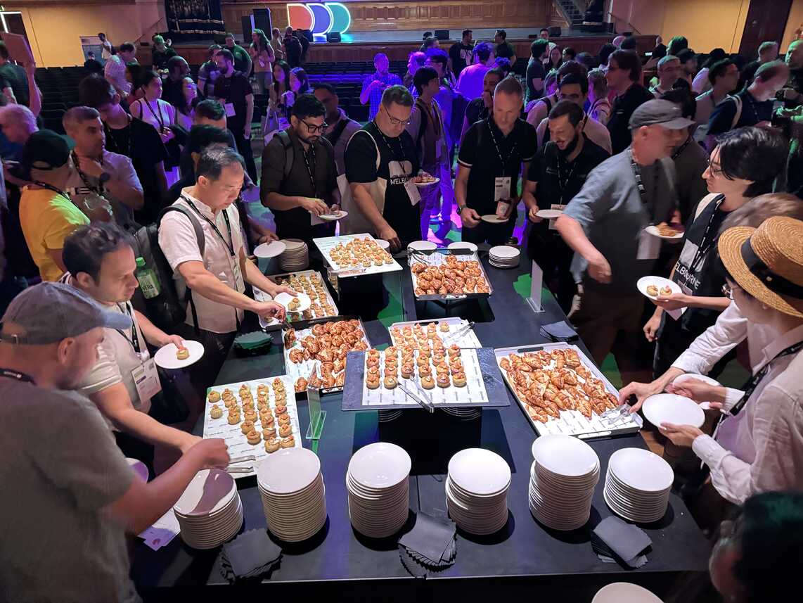 People getting morning tea from tables